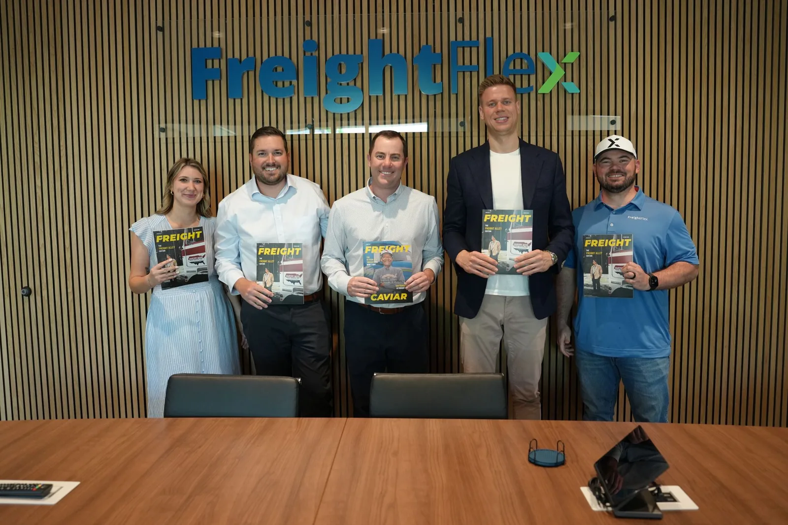 Freight Flex team members with Freight Caviar magazine