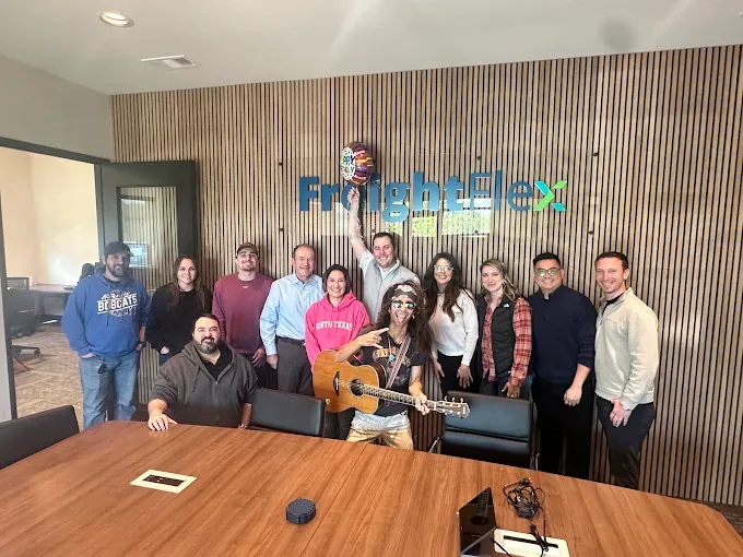 Freight Flex team members enjoying music together in the office