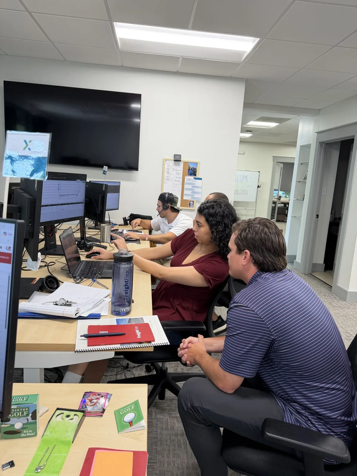 Freight Flex employees learning together in the office