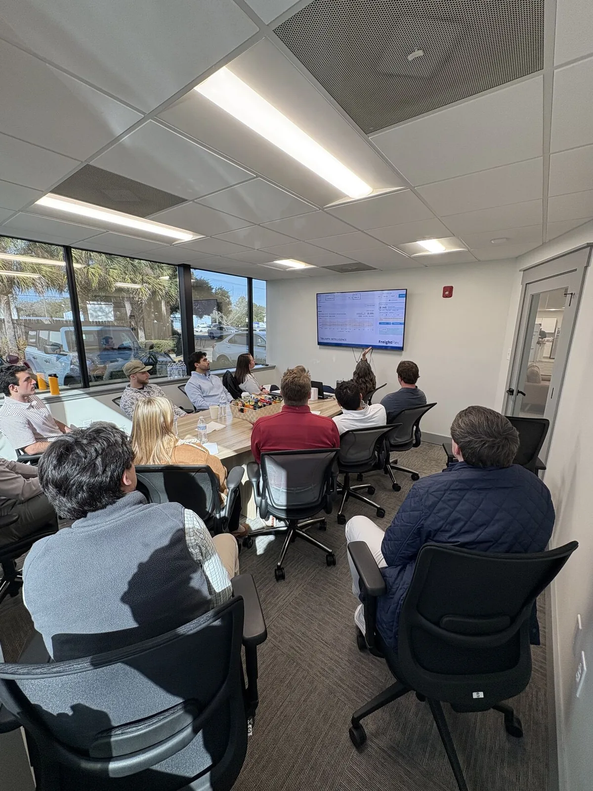 Freight Flex team members participating in an office training session